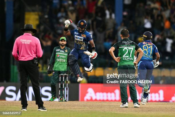 Sri Lanka's Charith Asalanka (C) celebrates the win at the end of the Asia Cup 2023 Super 4 one-day international (ODI) cricket match between Sri Lanka and Pakistan at the R. Premadasa Stadium in Colombo early September 15, 2023. (Photo by Farooq NAEEM / AFP) (Photo by FAROOQ NAEEM/AFP via Getty Images)